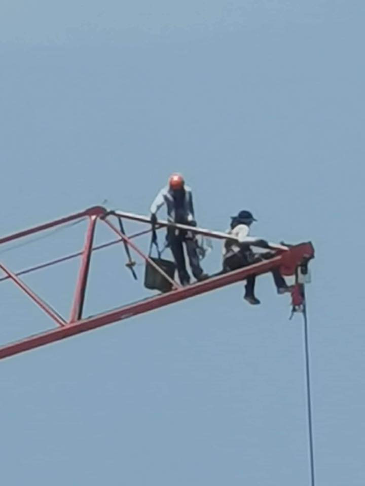 Don't believe it. Lunch without a helmet without a harness at the top of a tower under construction near Besser Bnei Brak. Memorandum ...