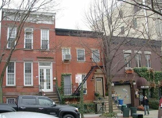 This small house in Brooklyn New York (in the center of the picture, with the front stairs) is now offered to ...