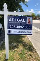 Image may contain: 1 person, tree, outdoor and nature, text that says 'ADI GAL BROKER ASSOCIATE 305-409-1305 WHARTON ADIGALPA.COM REALT GROUP'